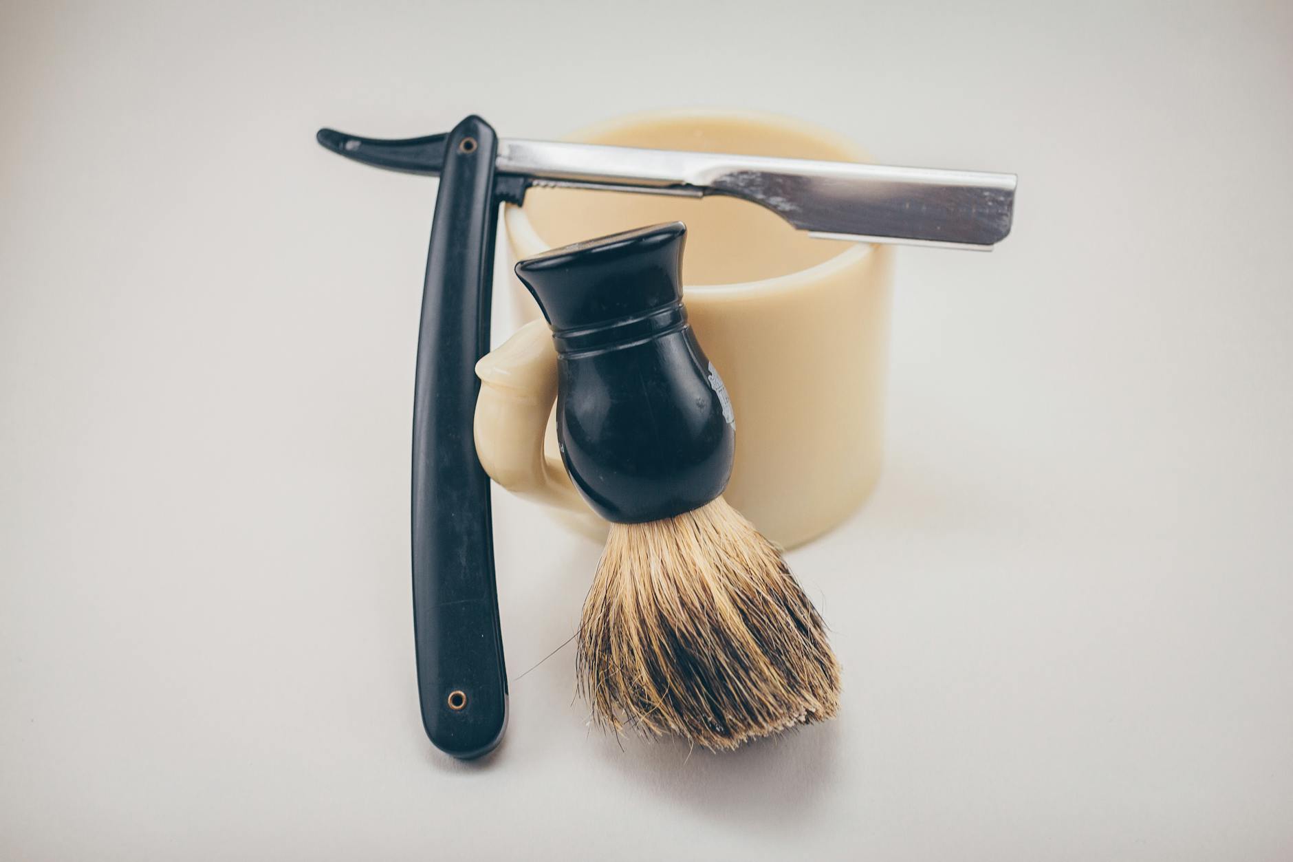 Barber performing a straight razor shave with precision